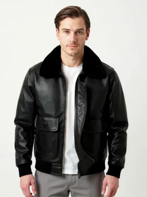 Homme portant un blouson en cuir noir avec col en fausse fourrure noire, veste bomber élégante.